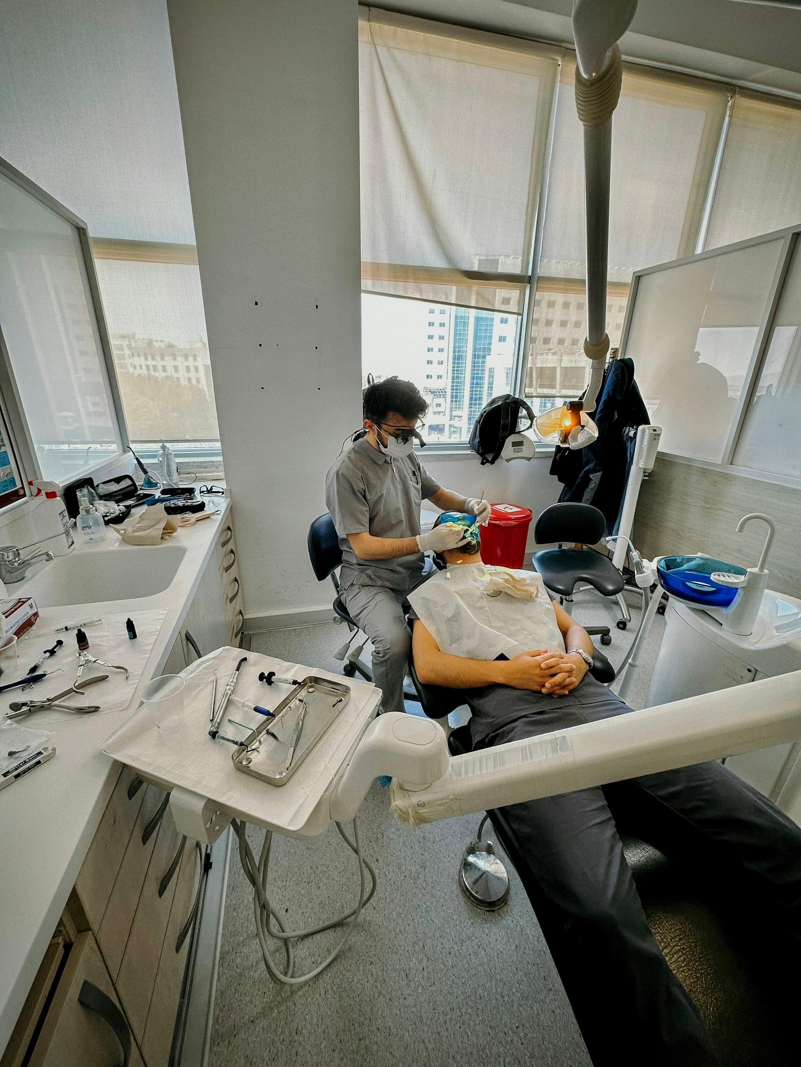 Dentist treating a patient in a bright dental clinic